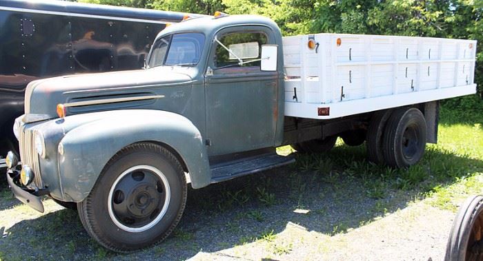 At 7PM: 1946 Ford 2-ton Stake-Body Dump Truck with 30" Grain Sides; V8 Engine; 4-speed Transmission; 2-speed Rear Axle; Hydraulic Dump on 13.6' Bed.