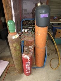 Big Welding set with 4 tanks helmet gauges and Tank caddy and tanks are full.