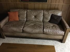 Wood Trimmed Leather Love seat (57’’ x 35’’ x 29’’)