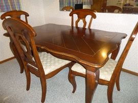 Solid wood table with 4 fabric seat chairs