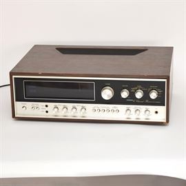 Pioneer 4-Channel Receiver QX-8000A: A Pioneer QX-8000A 4-Channel Receiver. Features a faux walnut case with black and silver tone face. The station selector powers on with a backlit blue color. It was tested in working condition.