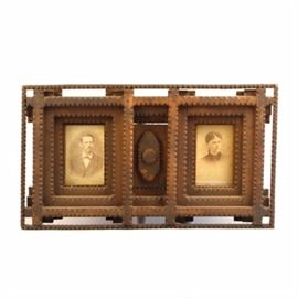 Carved Tramp Art Frame with Pair of Antique Portraits: A wonderful carved tramp art frame housing a pair of antique portraits of a man and woman. The frame is hand-crafted in a distinct tramp art style using carved layers of wood with sawtooth edging and stacked, giving the piece dimension.