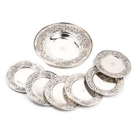 S. Kirk & Sons Sterling Silver Plates: A collection of sterling silver plates by S. Kirk & Sons. Included are six 6.25" plates and one 10.5" dish, each with a floral patterned rim and monogram to center. Each piece is marked S. Kirk & Sons Sterling, 728 / 127F" to underside. Total approximate weight is 37.10 ozt.