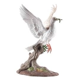 Limited Edition Boehm "Dove of Peace" Porcelain Figurine: A limited edition, signed porcelain Dove of Peace figurine by Boehm. This piece, style number 40236, is Issue Number 591. This elegant statuette depicts a white dove taking flight with an olive branch in its beak. It is marked and numbered by the maker to underside. Boehm Porcelain was started by Edward Marshall Boehm (1913-1969), an American sculptor most known for the porcelain birds and wildlife sculptures he created, promoted by his equally well-known spouse, Helen Boehm. Together, the two founded E.M. Boehm Studios. Works created in the studio are in the Metropolitan Museum of Art, and the studio is known for its fine and elegant sculptural work owned by museums, royalty and celebrities worldwide.