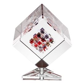 Jon Kuhn Optical Glass Sculpture "Chili Peppers": An Optical glass sculpture titled Chili Peppers by American artist, John Kuhn (born 1949). This clear glass cube balances on a corner on its base. Squares of red and yellow glass are visible to its interior. Its title is etched to the underside along with the artist’s signature and the year “1998.”