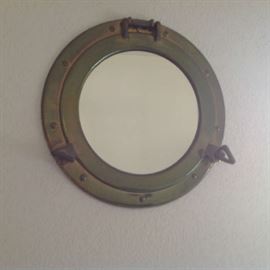 Brass port hole mirror (about 16" wide) $ 40.00