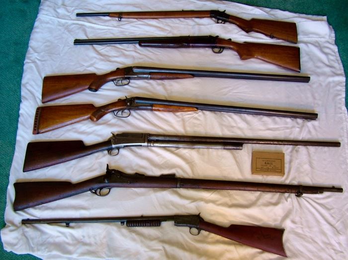 Bottom To Top 1. Winchester Model 1890. 2. Springfield 45-70. 3. National Fire Arms 12 Ga Shotgun. 4. 1914 Montgomery Ward (Western Field) 16ga double barrel hammer style Shotgun. 5. Western Field 16 Ga double barrel hammer style shotgun. 6. Stevens Arms 22-410. 7. Enders Royal Scout 22 L rifle. 