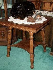 Very nice Oak Parlor Table w 5 gal Libbey Amber Glass piggy bank w cork snout