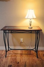 Entry table with wrought iron legs, table lamp