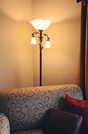 Floral floor lamp and La-Z-Boy chair and a half 