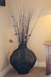Woven vase and floral arrangement