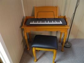 Great Wood keyboard stand and padded seat with Queen Ann style legs.  Casio keyboard is separate.