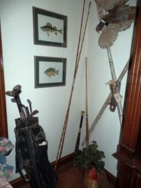 A collection of vintage golf clubs and fishing gear, super cute for decorating!