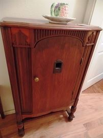 Antique cabinet with shelving inside