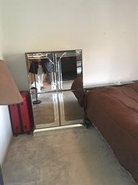 Mirrored armoire with magnetic opened doors (2 available), but willing to separate