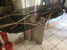 Contemporary console table with modern vibe.  Artist custom painted stone top with metal base.  Approx. dimensions: 48" h x 42" w x 16" d