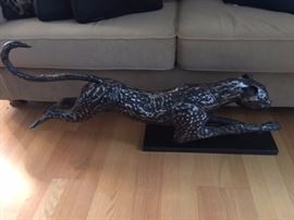 Metal cheetah sculpture