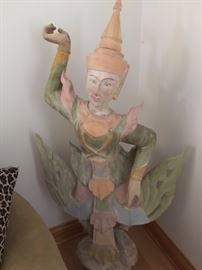 Wooden dancing girl carved statue.  Approximate dimensions 46"h x 26"w x 12"d