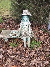 Girl on bench statue