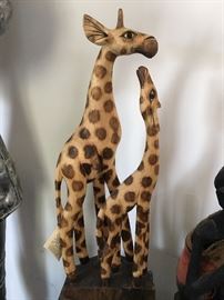 Mother giraffe and baby wooden statue