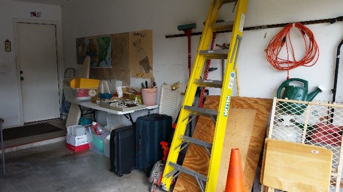  A lot of garage stuff.  Ladders, garden accessories,  T.V.. tables, card table and 4 chairs, Horizon treadmill,  power equipment( edger, hedger, blower etc.).
