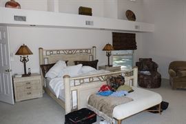Master bedroom, Lamps have leather shades.  Cheetah fainting couch on the right. 