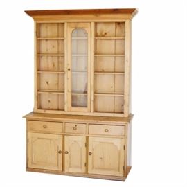 French Pine Hutch: A French pine hutch. This classic hutch features a top piece, that comes apart from the base, that has three sections for storing china. Each section has five shelves and glass doors. The doors have been removed from the side shelves but are included with the sale of this piece. The bottom has three drawers and three cabinets for storage.