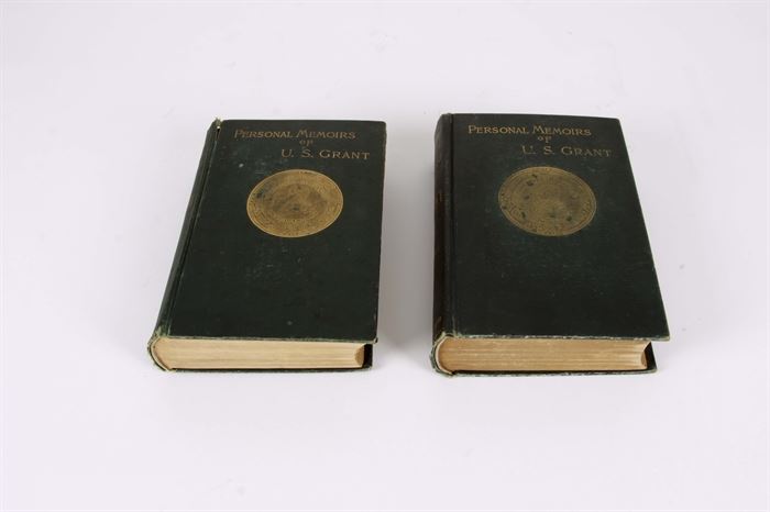 Antique "Personal Memoirs of U.S. Grant" Vol. I and II: A two volume set entitled Personal Memoirs of U.S. Grant. Published by Charles L. Webster & Company in New York, Volume I has a 1885 copyright date, and Volume II was copyrighted in 1886. Each is bound in a dark green cloth cover with a gilt medallion featuring Major General Ulysses S. Grant’s image to the front center. A gilt medallion to the back cover is marked Mississippi River. Each volume features a tissue-guarded frontispiece portrait of Grant, maps, facsimile inscriptions and letters. The Personal Memoirs of U. S. Grant is an autobiography of Ulysses S. Grant, the 18th President of the United States, focused mainly on his military career during the Mexican-American War and the American Civil War. Written as Grant was dying of cancer in 1885, the two-volume set was published by Mark Twain shortly after Grant’s death.