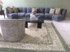 Custom upholstered wool crescent sectional sofa by Classic Galleryvintage area rug