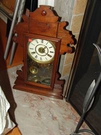 Walnut and brass clock