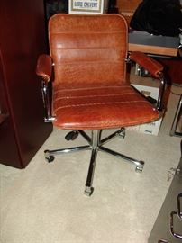 Office chair on rollers upholstered in crocodile leather
