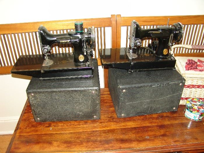 Two portable Singer sewing machines