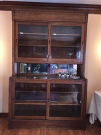 Great piece with original glass and sliding shelves. Almost a modern clean line   Great storage or display piece