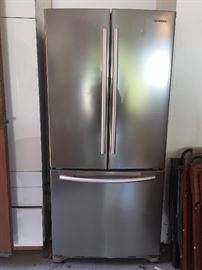 Nice compact smashing French door stainless steel refrigerator  2 small dimples