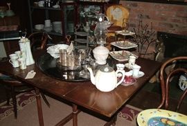 antique table, cane chairs, porcelain, glass, silver, servingware