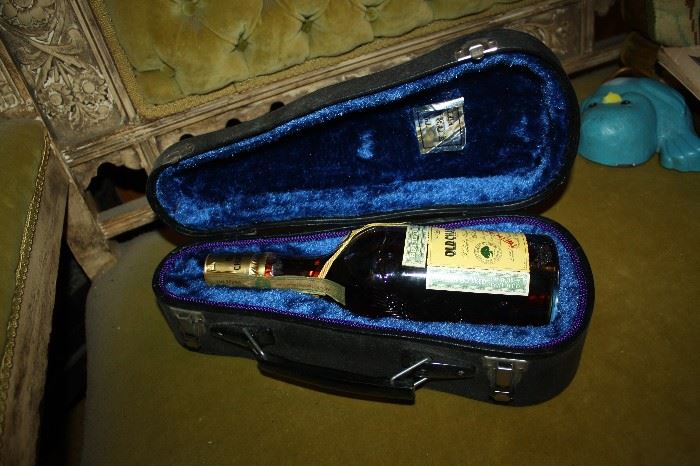 OLD CHARTER BOURBON IN VIOLIN  CASE NOT SURE IF THIS CASE WAS MADE FOR THIS BOTTLE.....BUT FITS IT PERFECTLY!