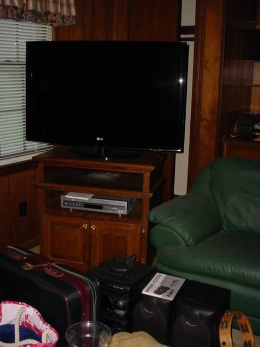 Another flat screen TV, stereo equipment, luggage and more