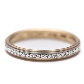 18K Yellow Gold and Platinum Wedding Band: An 18K yellow gold wedding band is graced with a band of platinum with an incised design. The inside of the band is engraved “H C Kand E.L.H. Oct 16th 1900.”