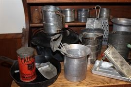 Flour sifter collection and a Griswold cast iron skillet on the left