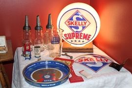 Vintage Skelly items, Hamm's beer tray and oil bottles. Skelly Supreme Gasoline Globe