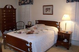 Master bedroom with queen bed, nightstands, highboy, dressers.