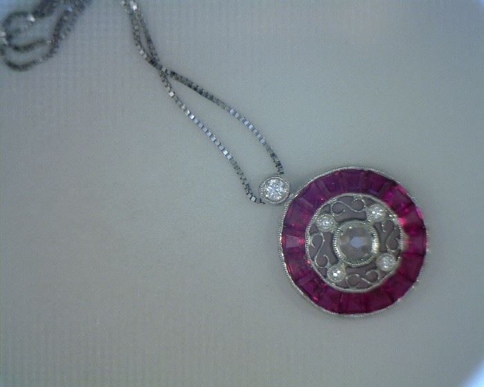 18K white hold pendant with .20 ct diamond and 1.28 ct rubies