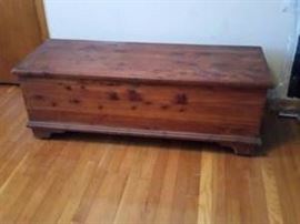 Rustic cedar chest with key.