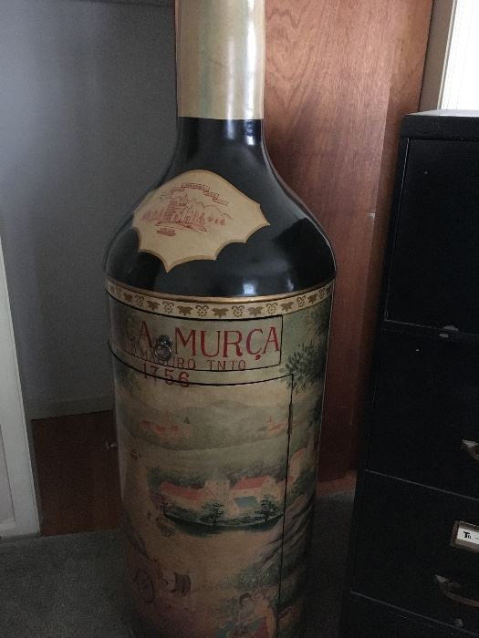 This large bottle of Wine opens up to hold your wine