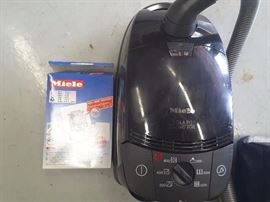 Close up of Miele Vacuum Cleaner and Bags.