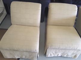 Two beige lounge chairs.