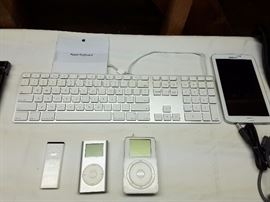 Apple keyboard,  iPod 2004 version, iPod apple 10GB, iPod mini. Samsung tablet.