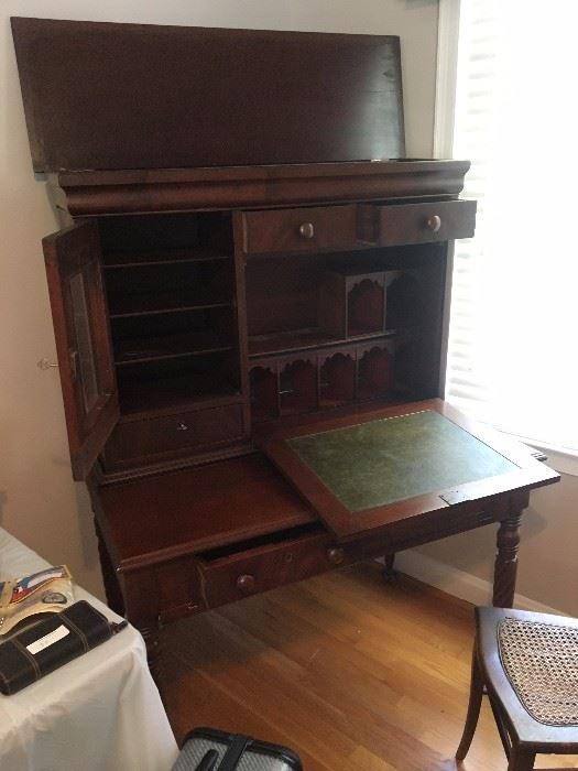 Antique mahogany writing desk with lots of unique storage options