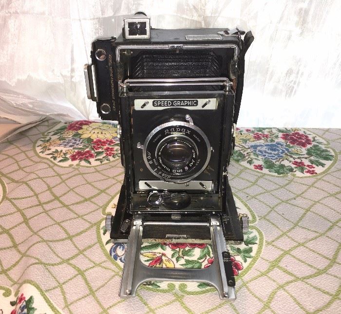 Antique professional Graflex Speed Graphic fold-out camera with film cartridges (not shown)