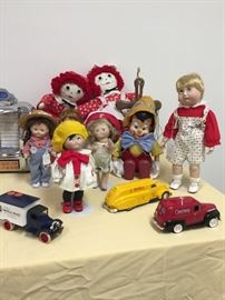 An eclectic collection of dolls including: three Campbell Kid dolls from 1996, Danbury mint; Pinocchio puppet by TEL-co, one of the MOTION-ettes series and more!